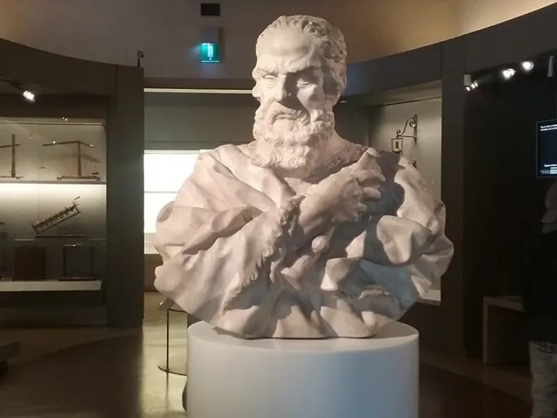 Galileo Galilei kneels in front of the church